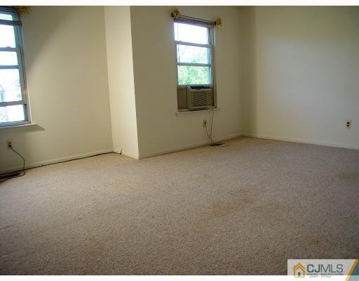 114 Redbud Road, Unit 114 Piscataway, NJ 08854 - Photo 6 of 7 a view of an empty room with a window