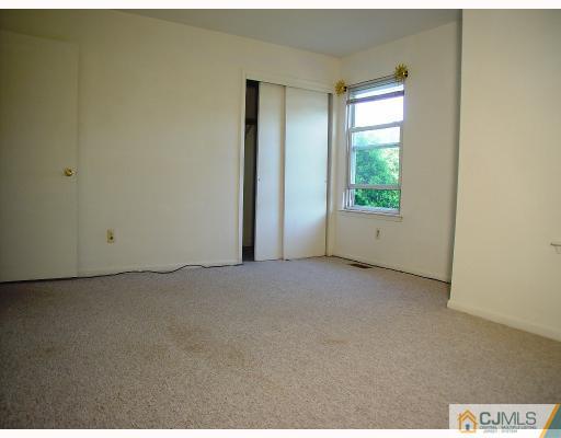 114 Redbud Road, Unit 114 Piscataway, NJ 08854 - Photo 7 of 7 a view of an empty room and window