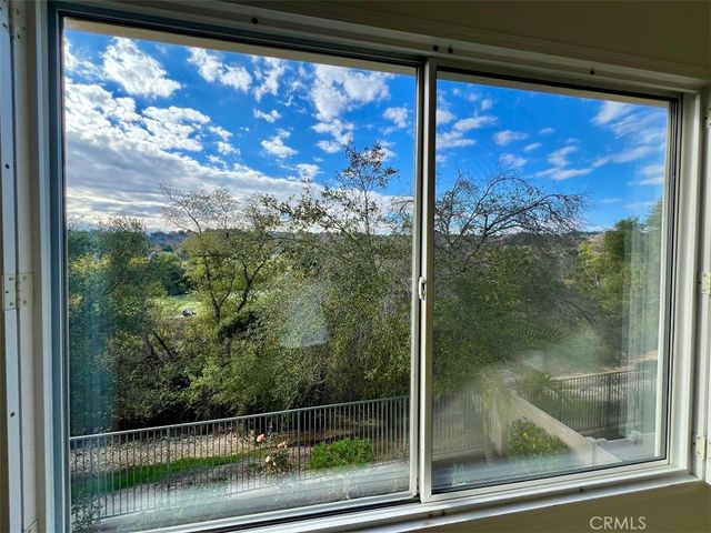 a view of a glass door and a window
