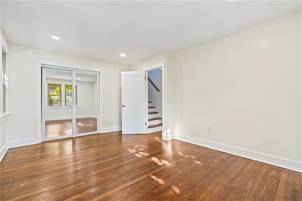 100 Race Street Pittsburgh, PA 15218 - Photo 11 of 25 a view of an empty room with wooden floor and a window