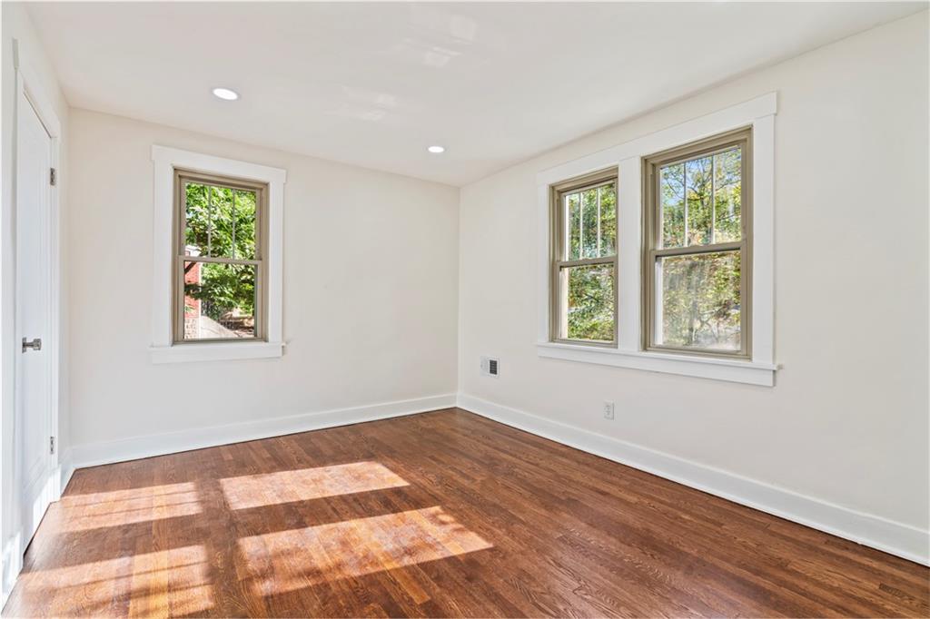 100 Race Street Pittsburgh, PA 15218 - Photo 13 of 25 a view of an empty room with wooden floor and a window