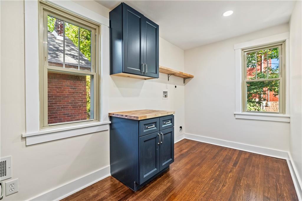 100 Race Street Pittsburgh, PA 15218 - Photo 15 of 25 an empty room with wooden floor and windows