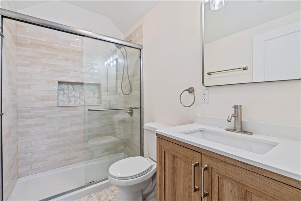 100 Race Street Pittsburgh, PA 15218 - Photo 18 of 25 a bathroom with a sink toilet and shower