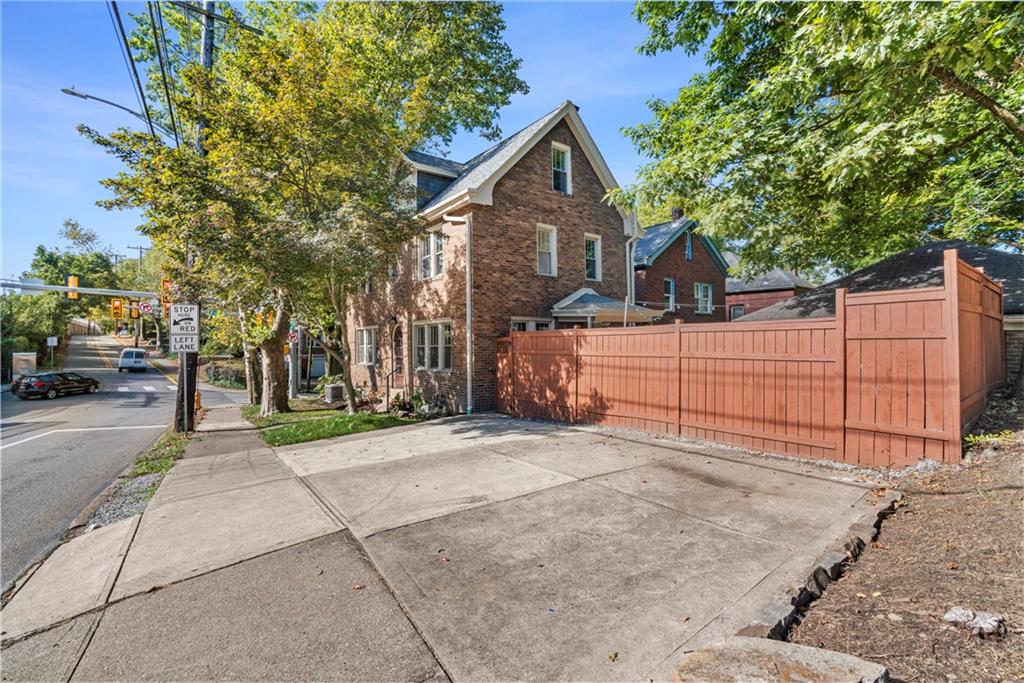 100 Race Street Pittsburgh, PA 15218 - Photo 22 of 25 a view of a yard and a house with a large tree