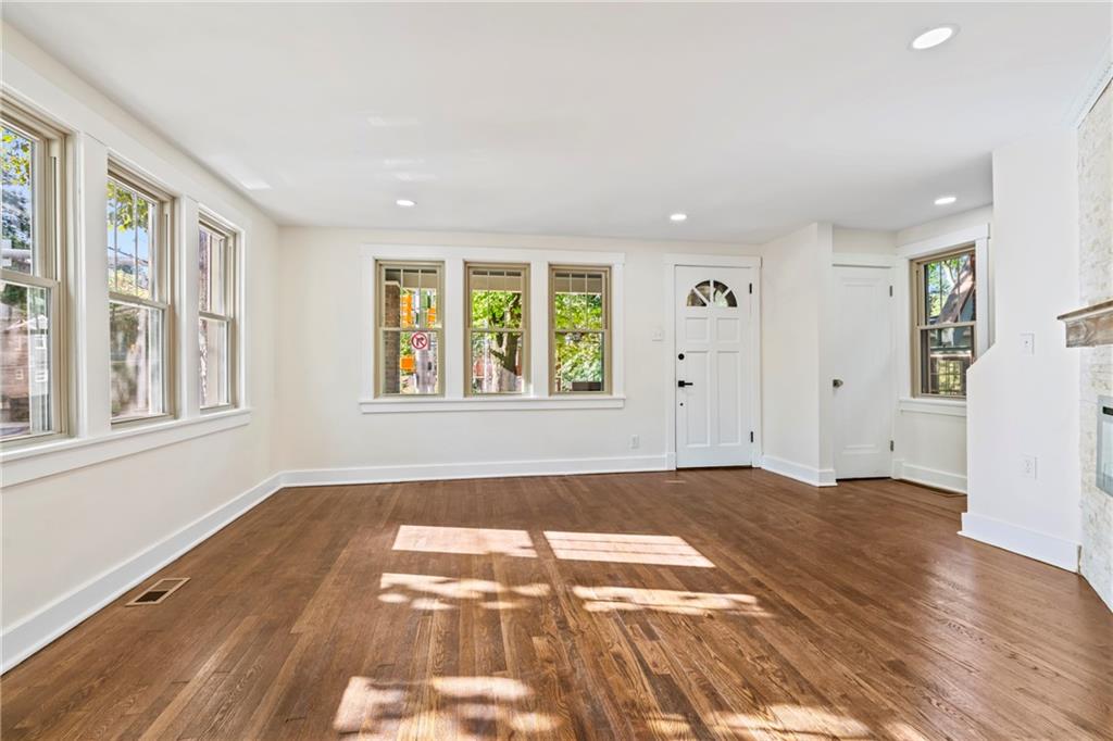 100 Race Street Pittsburgh, PA 15218 - Photo 6 of 25 an empty room with wooden floor and windows