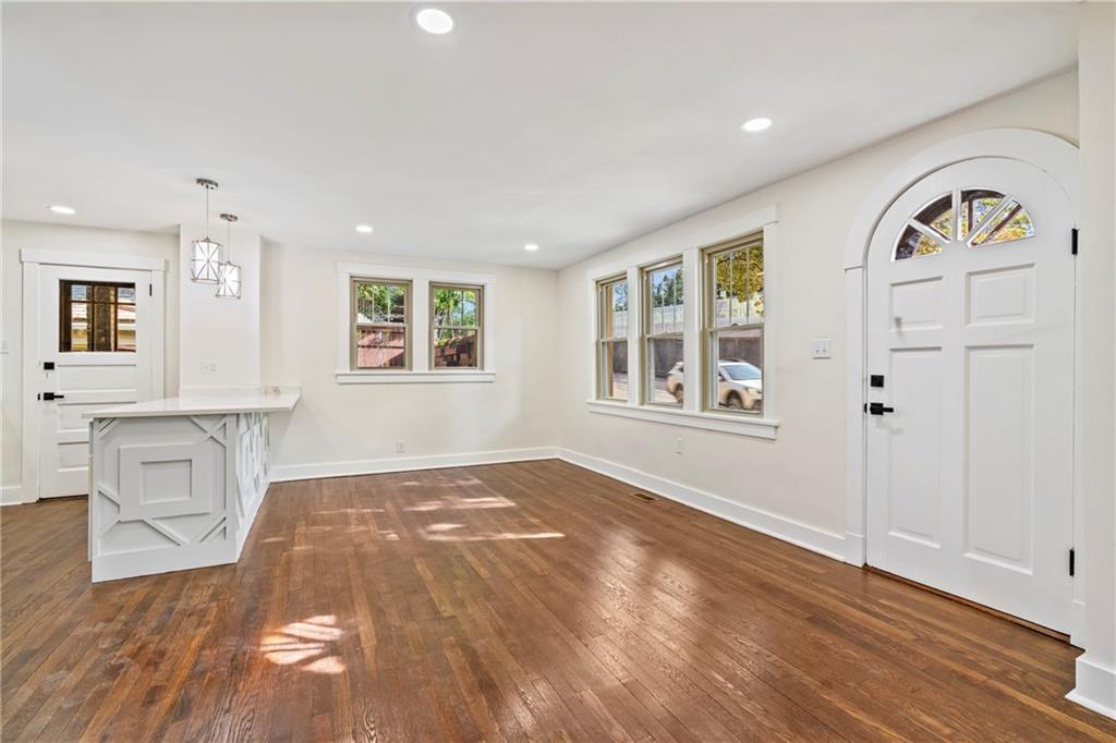 100 Race Street Pittsburgh, PA 15218 - Photo 8 of 25 a view of an empty room with window and wooden floor