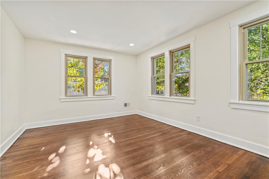 100 Race Street Pittsburgh, PA 15218 - Photo 10 of 25 a view of an empty room with a window and wooden floor