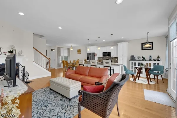 a bedroom with furniture and a flat screen tv