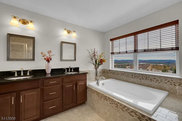 a view of a swimming pool and lounge chairs