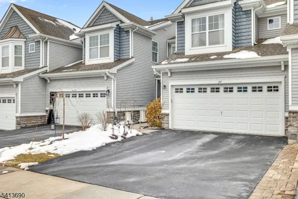 a kitchen with stainless steel appliances granite countertop a refrigerator stove and oven