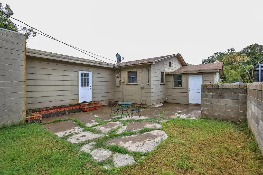 3408 38th Street Lubbock, TX 79413 - Photo 17 of 18 a backyard of a house with table and chairs