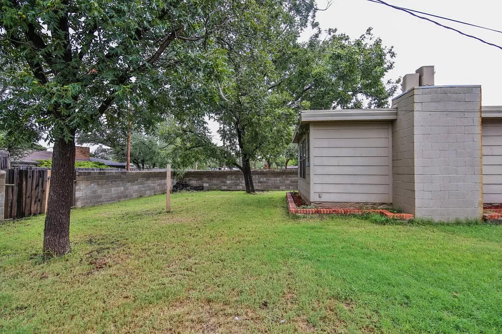 3408 38th Street Lubbock, TX 79413 - Photo 18 of 18 a backyard of a house with lots of green space