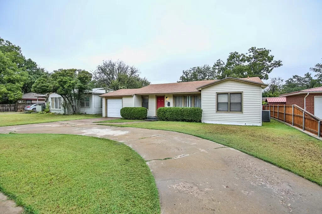 3408 38th Street Lubbock, TX 79413 - Photo 2 of 18 a view of a house with a backyard