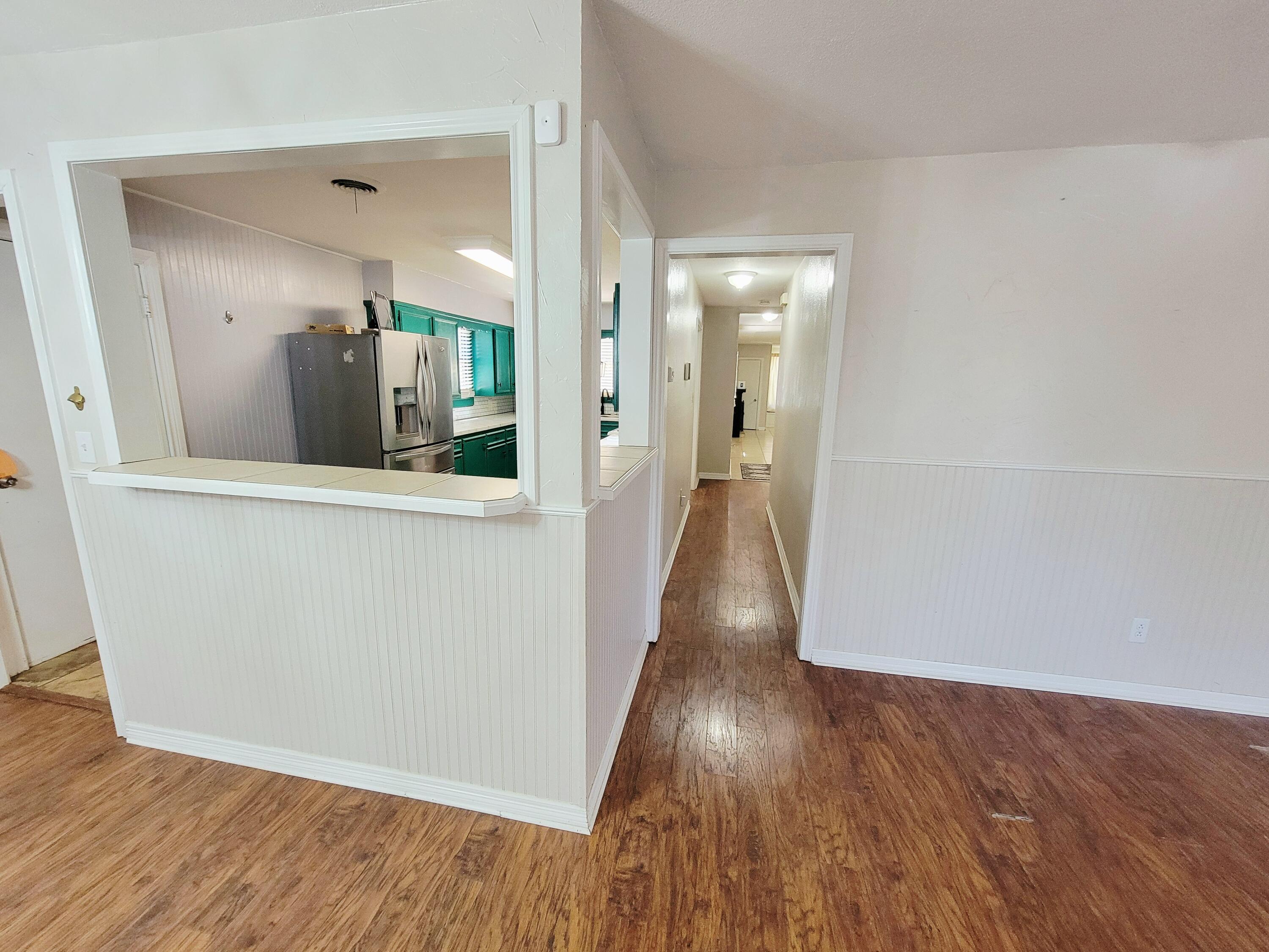 3408 38th Street Lubbock, TX 79413 - Photo 6 of 18 wooden floor in a kitchen