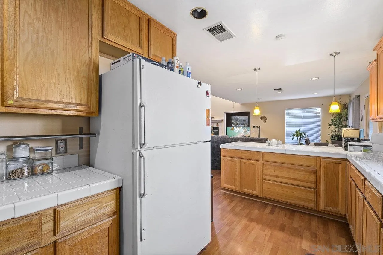 863 Rydell Place El Cajon, CA 92021 - Photo 12 of 23 a kitchen with refrigerator cabinets and a sink