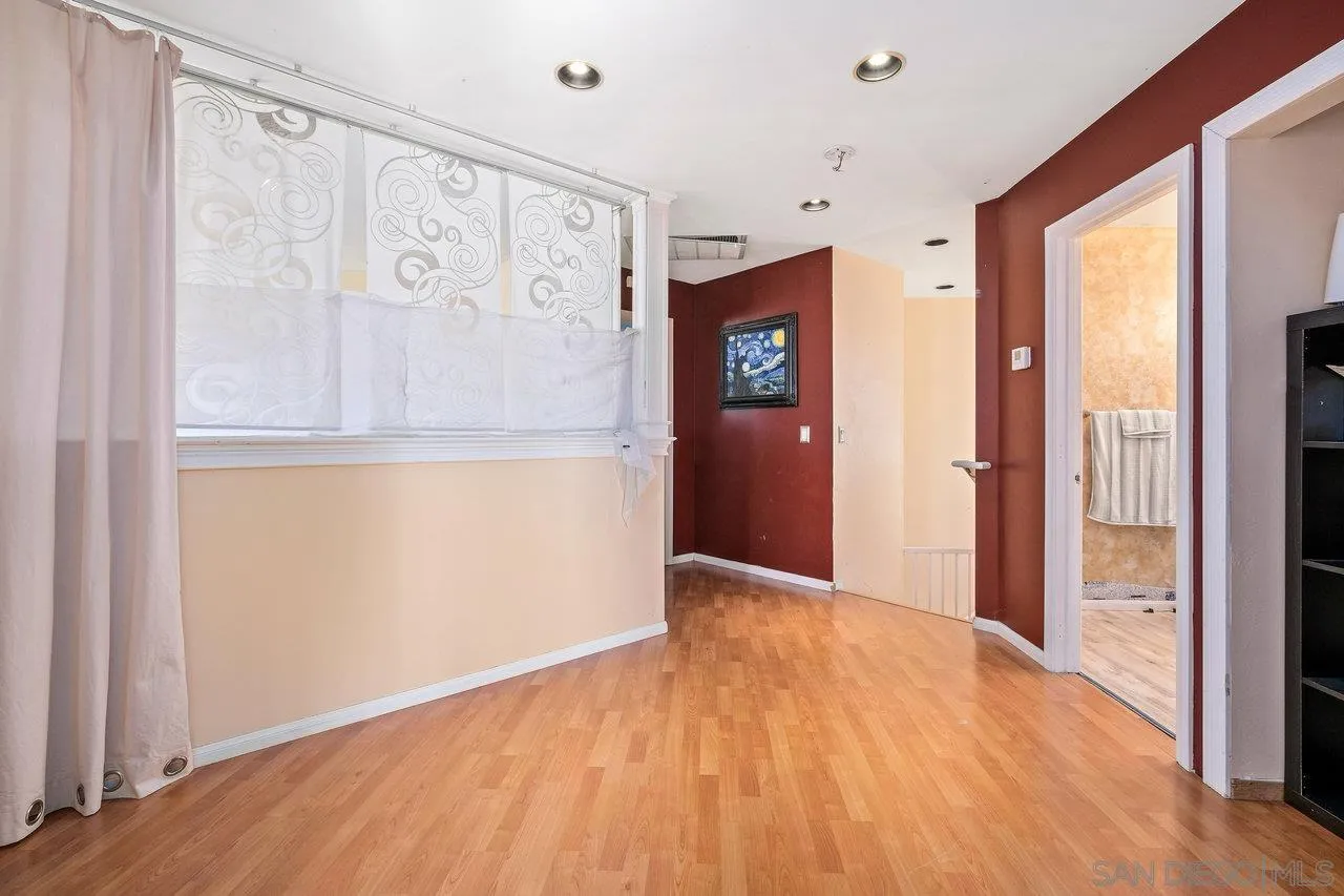863 Rydell Place El Cajon, CA 92021 - Photo 15 of 23 a view of hallway with wooden floor and cabinet