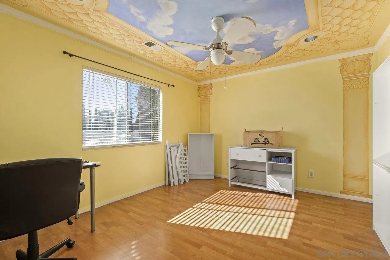 863 Rydell Place El Cajon, CA 92021 - Photo 16 of 23 a bedroom with a bed and wooden floor