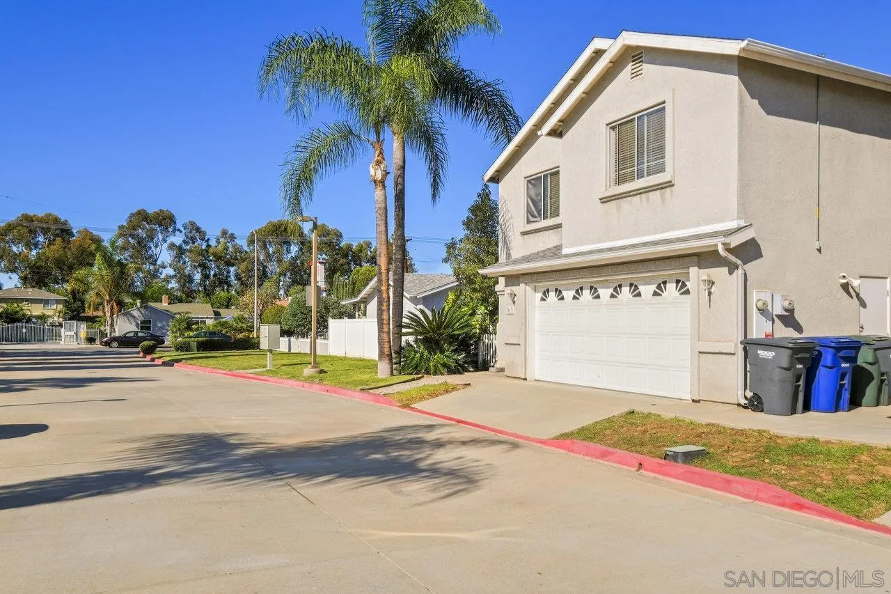 863 Rydell Place El Cajon, CA 92021 - Photo 2 of 23 a front view of a house with a yard and garage