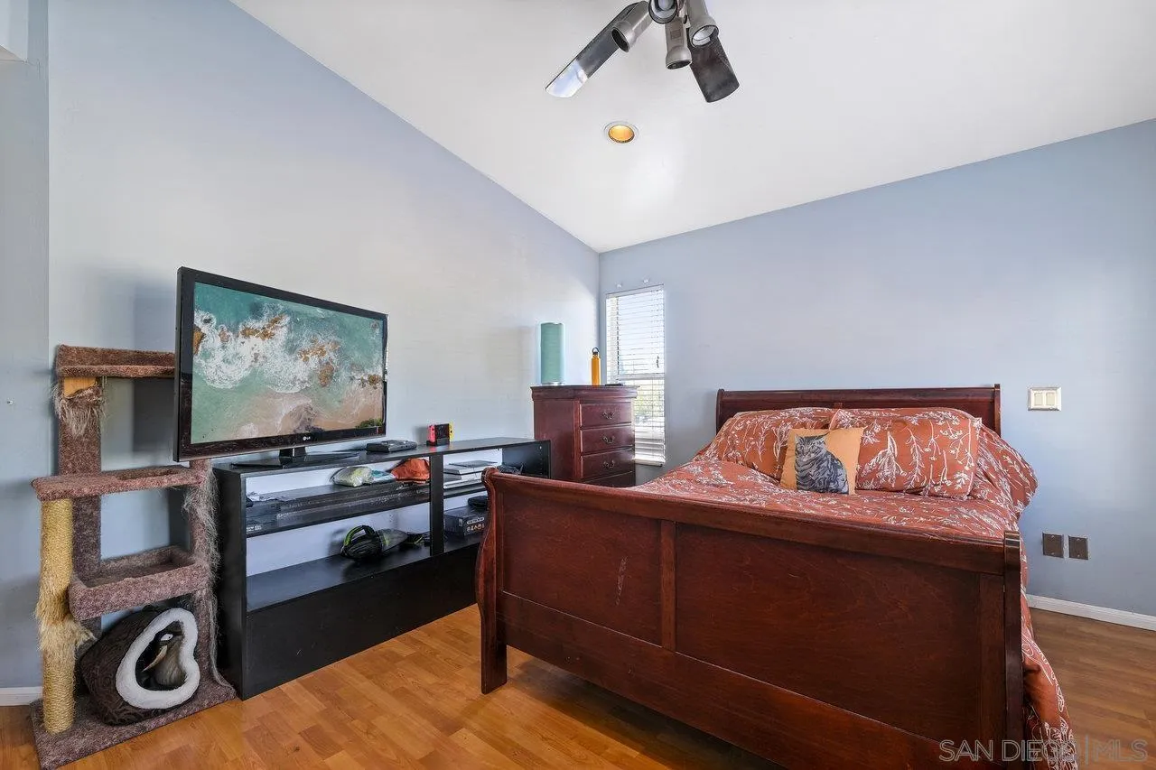 863 Rydell Place El Cajon, CA 92021 - Photo 22 of 23 a bedroom with a bed and a flat screen tv