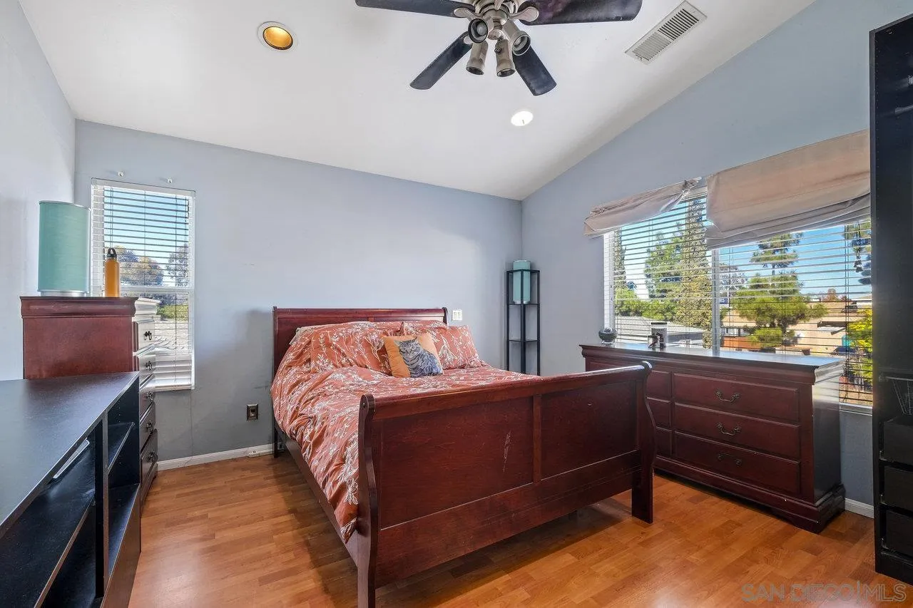 863 Rydell Place El Cajon, CA 92021 - Photo 23 of 23 a bedroom with a bed and a chandelier