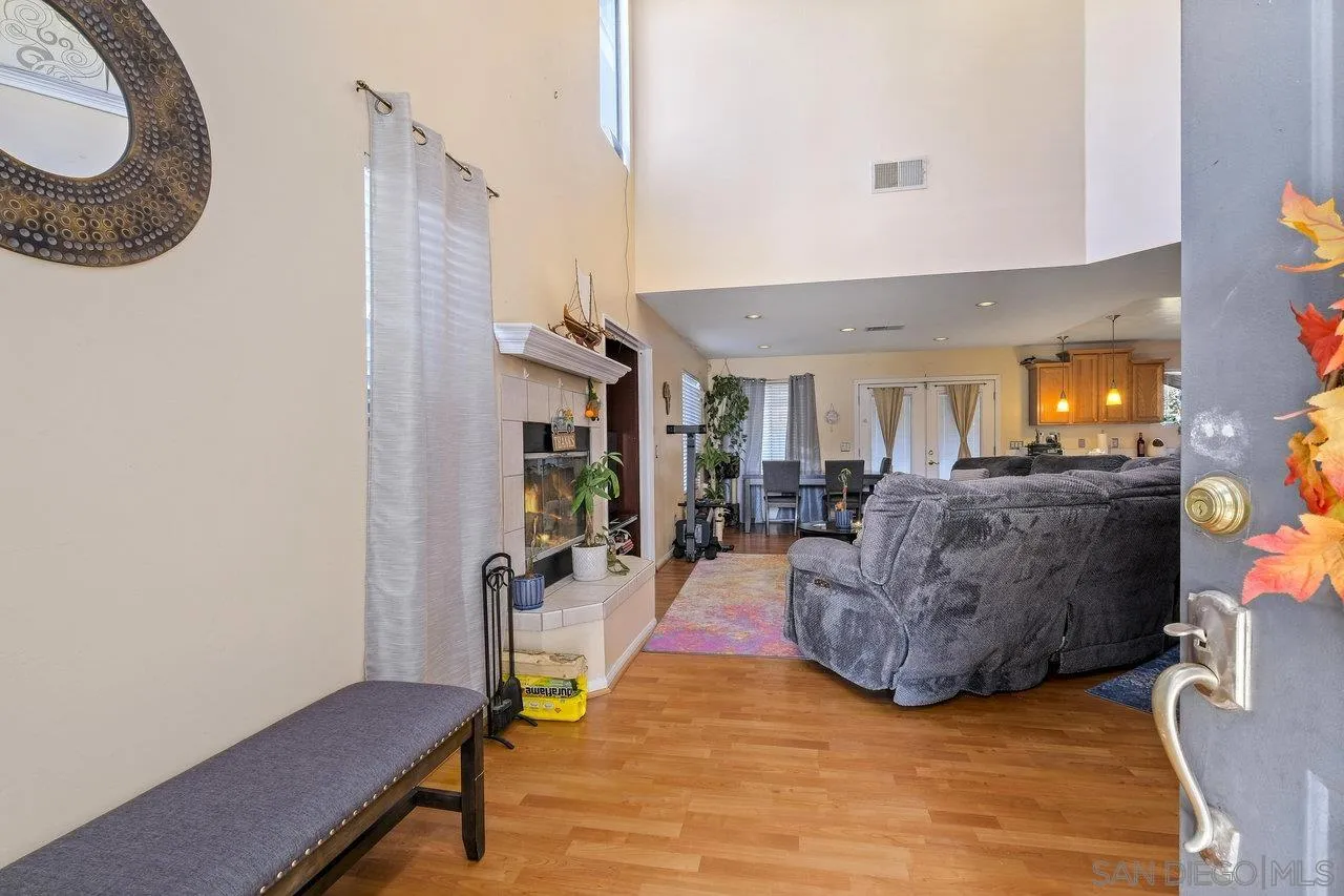 863 Rydell Place El Cajon, CA 92021 - Photo 4 of 23 a living room with furniture and a wooden floor