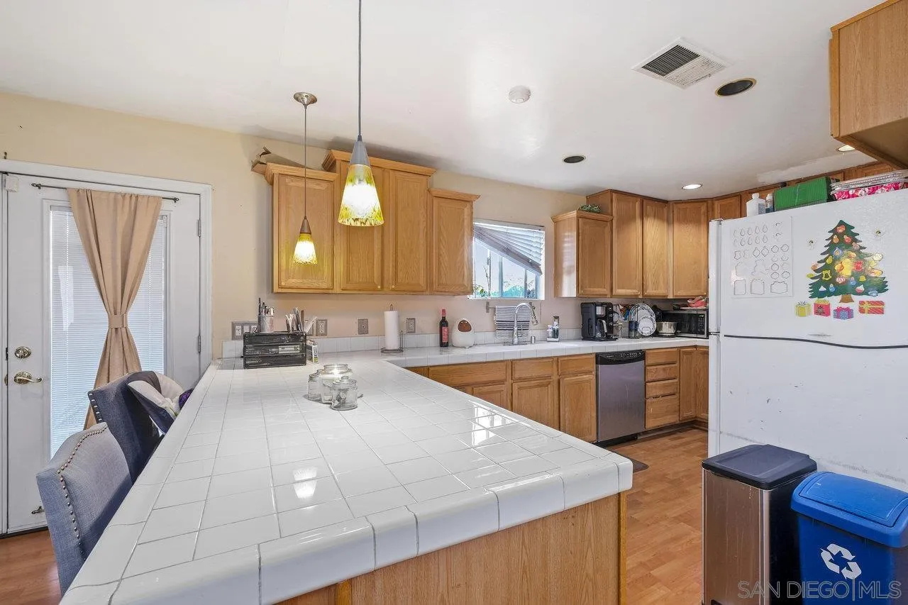 863 Rydell Place El Cajon, CA 92021 - Photo 9 of 23 a kitchen with a sink appliances and cabinets