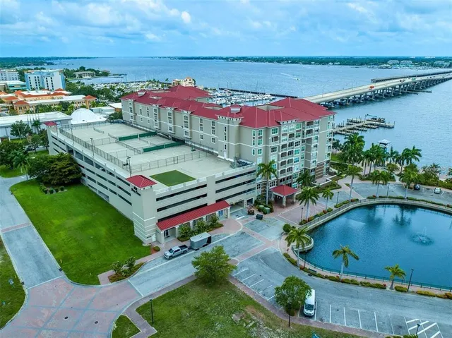 an aerial view of a house with swimming pool patio and outdoor seating