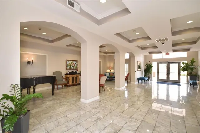 a lobby with furniture and wooden floor