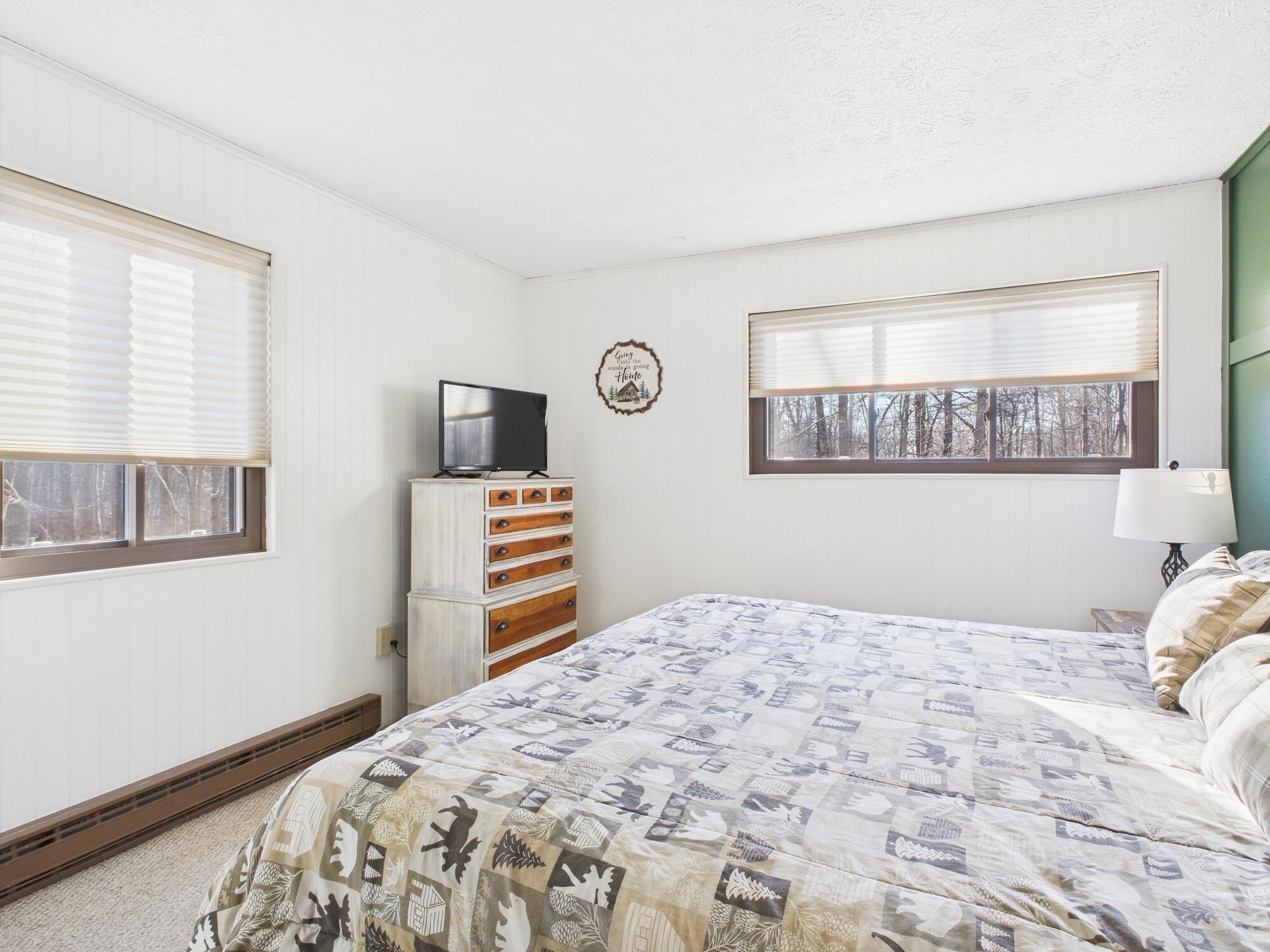 193 Elk Run Road Pocono Lake, PA 18347 - Photo 24 of 51 a bedroom with a bed and a television