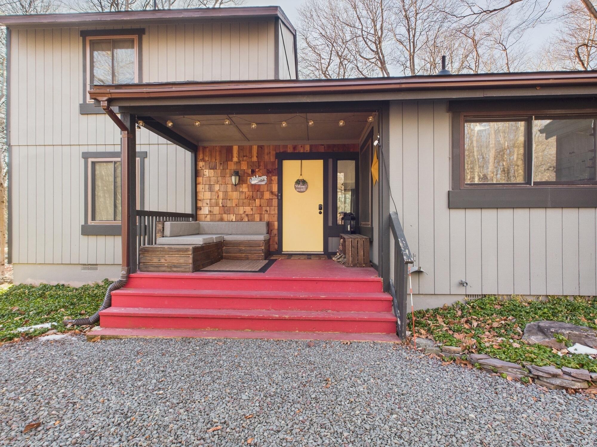 193 Elk Run Road Pocono Lake, PA 18347 - Photo 3 of 51 a front view of a house with a yard