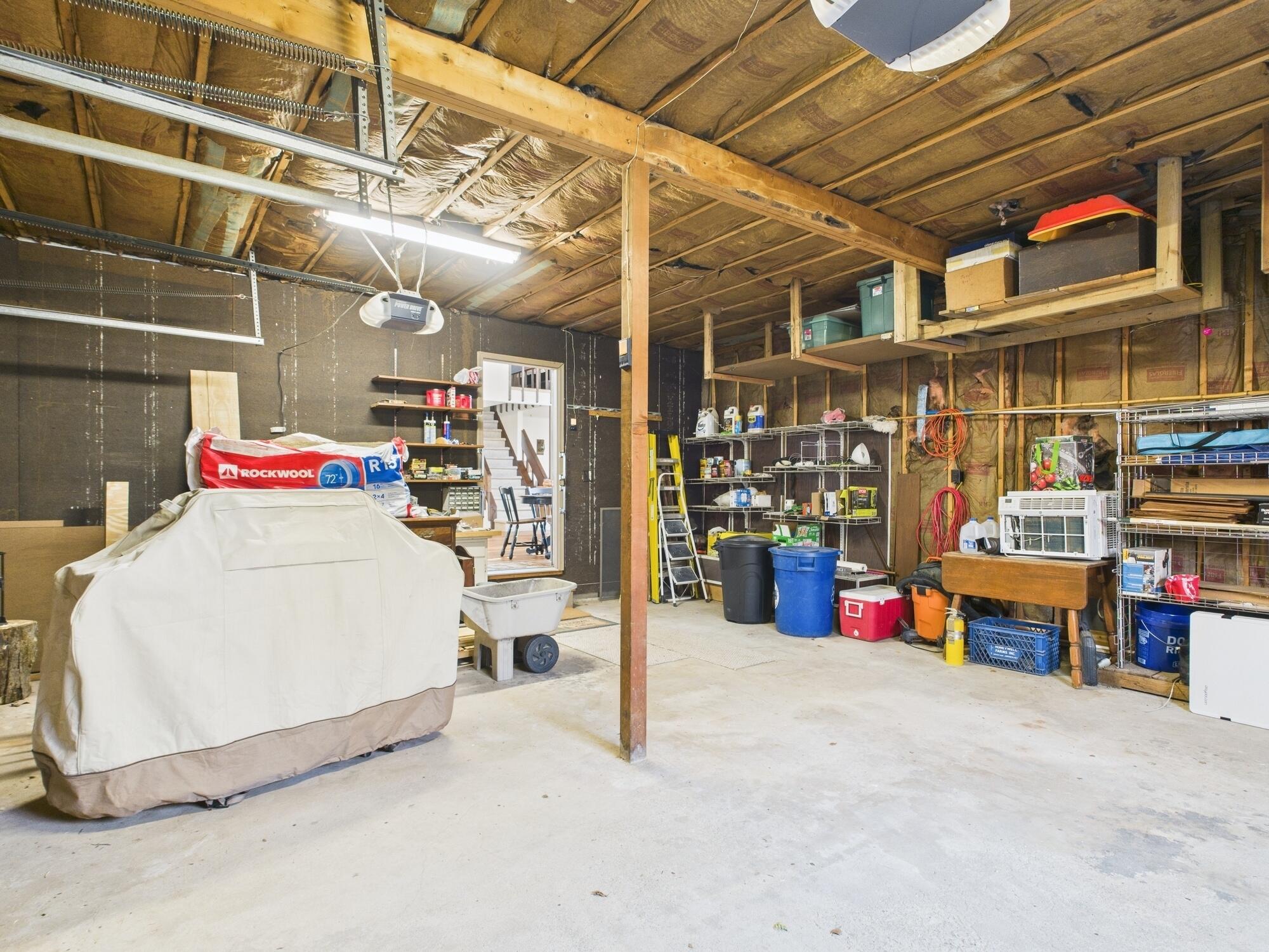 193 Elk Run Road Pocono Lake, PA 18347 - Photo 41 of 51 a storage room with stainless steel appliances wooden floor