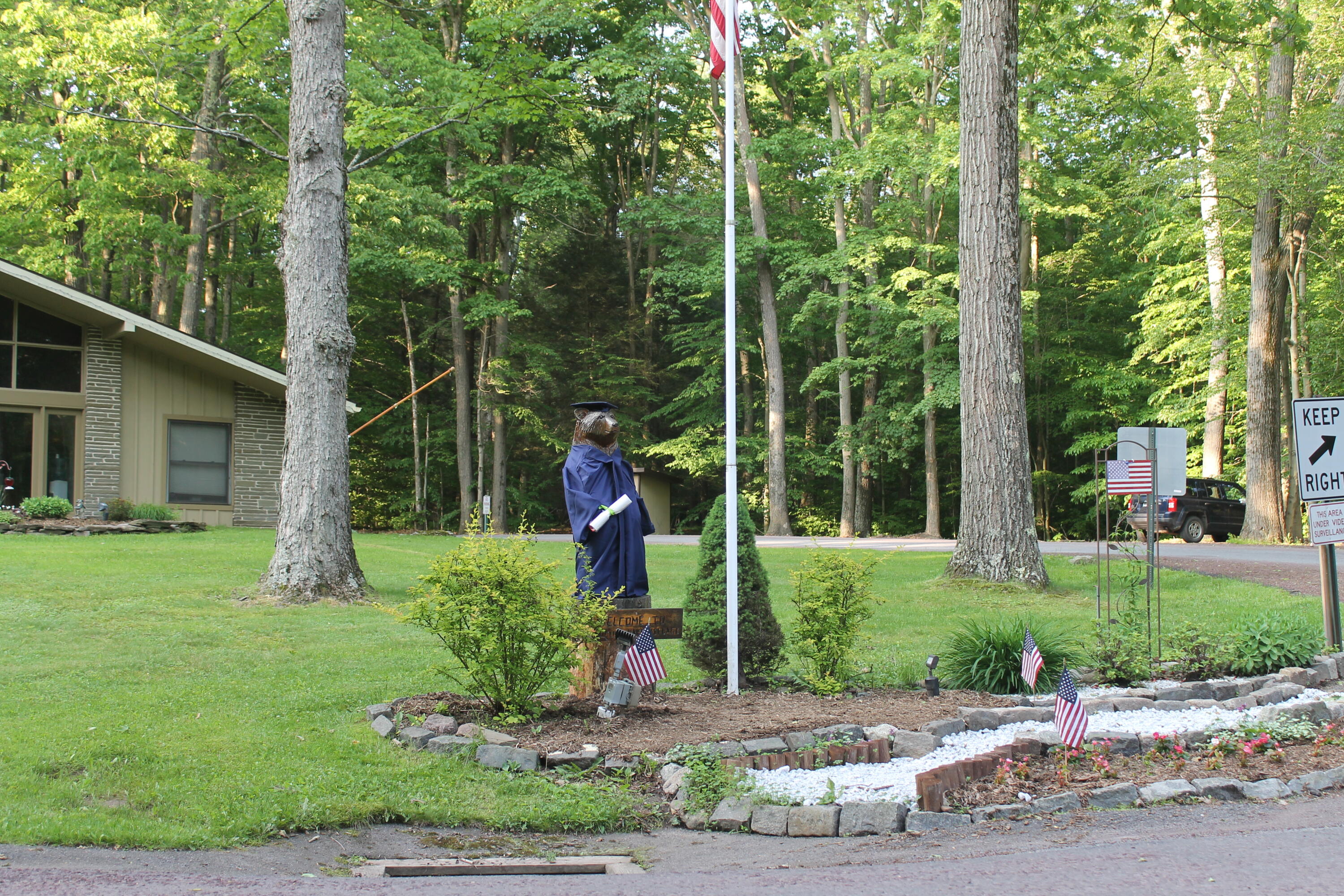 193 Elk Run Road Pocono Lake, PA 18347 - Photo 51 of 51 a front view of a house with garden