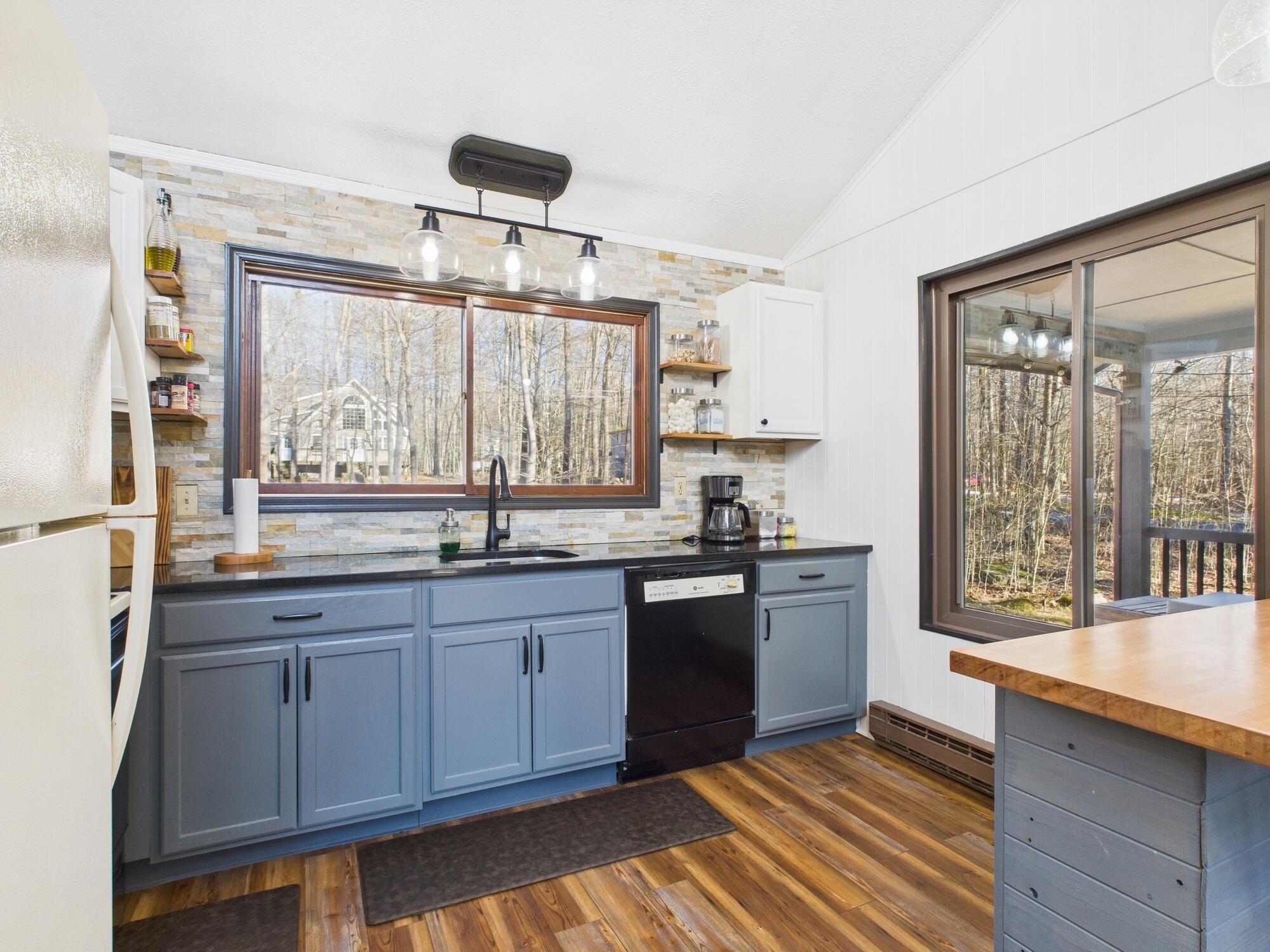 193 Elk Run Road Pocono Lake, PA 18347 - Photo 7 of 51 a kitchen with stainless steel appliances granite countertop a stove a sink and a granite countertops with cabinets