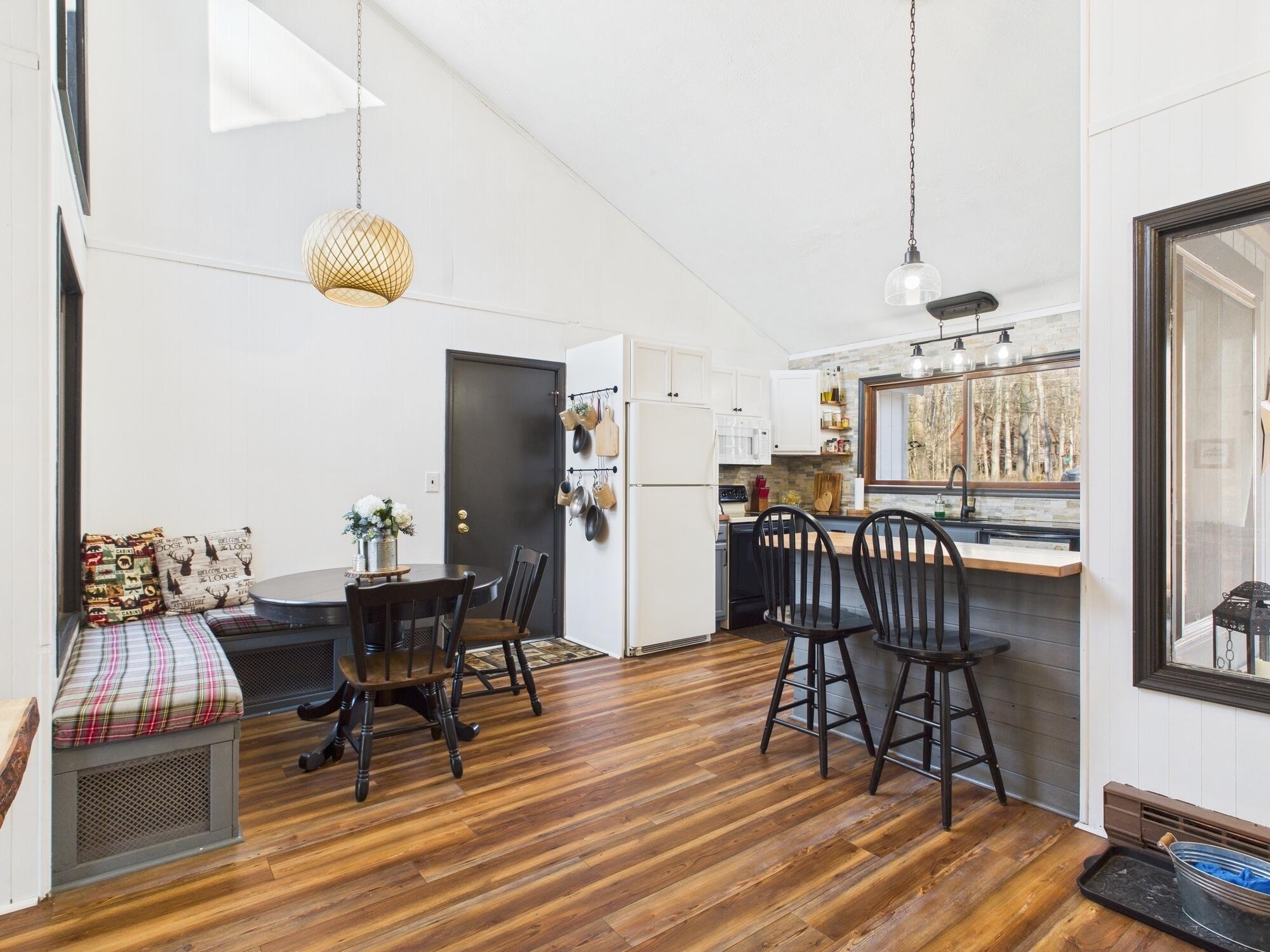 193 Elk Run Road Pocono Lake, PA 18347 - Photo 8 of 51 a view of a dining room with furniture and wooden floor