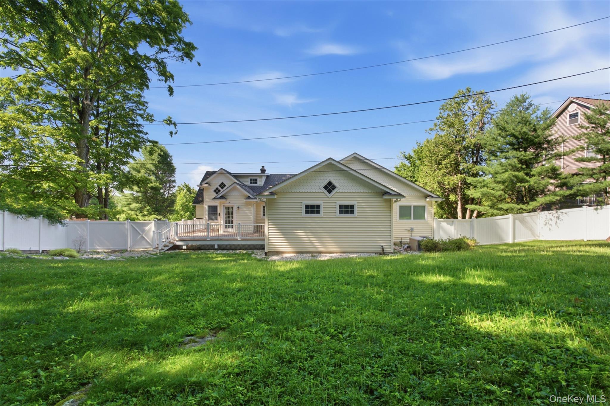 12 Leeside Road Carmel, NY 10512 - Photo 35 of 44 Expansive lawn area featuring a white privacy fence