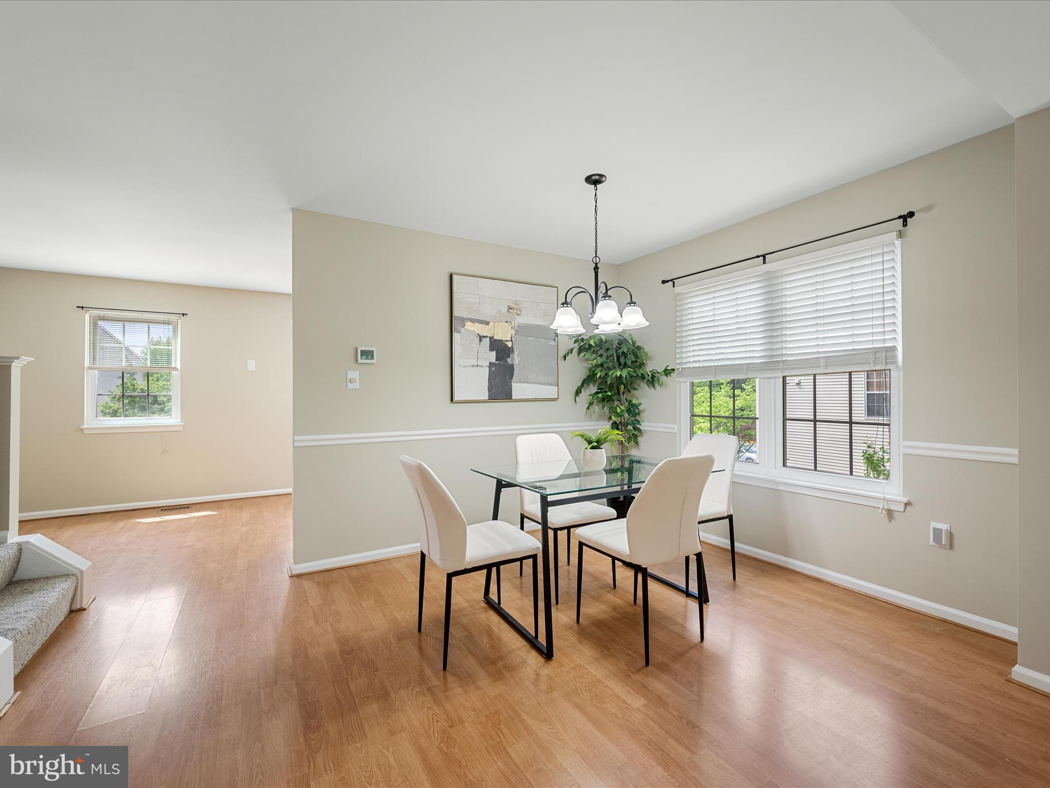 20760 Apollo Terrace Ashburn, VA 20147 - Photo 12 of 50 a view of a dining room with furniture window and wooden floor