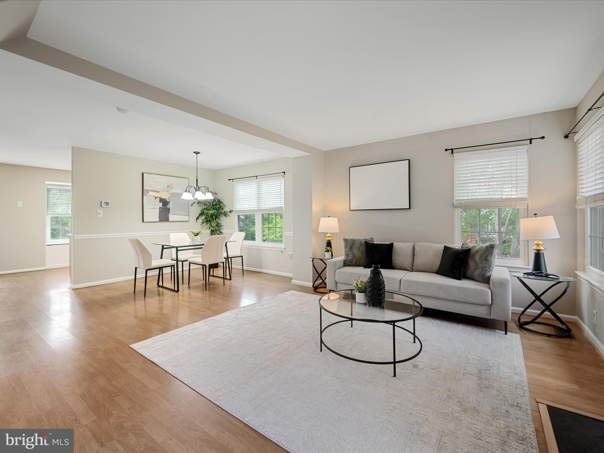 20760 Apollo Terrace Ashburn, VA 20147 - Photo 13 of 50 a living room with furniture a large window and a table