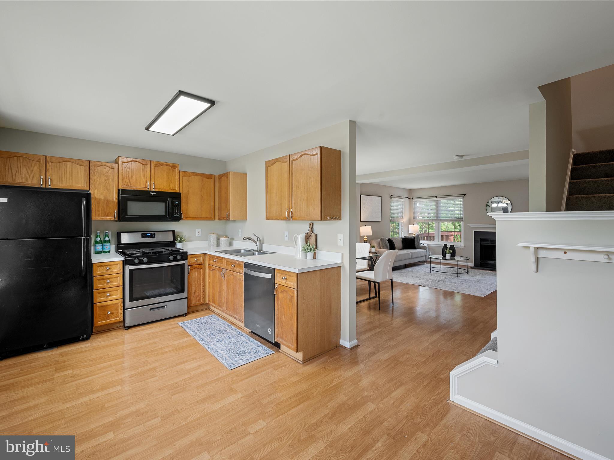 20760 Apollo Terrace Ashburn, VA 20147 - Photo 17 of 50 a large kitchen with a large counter top stainless steel appliances and cabinets