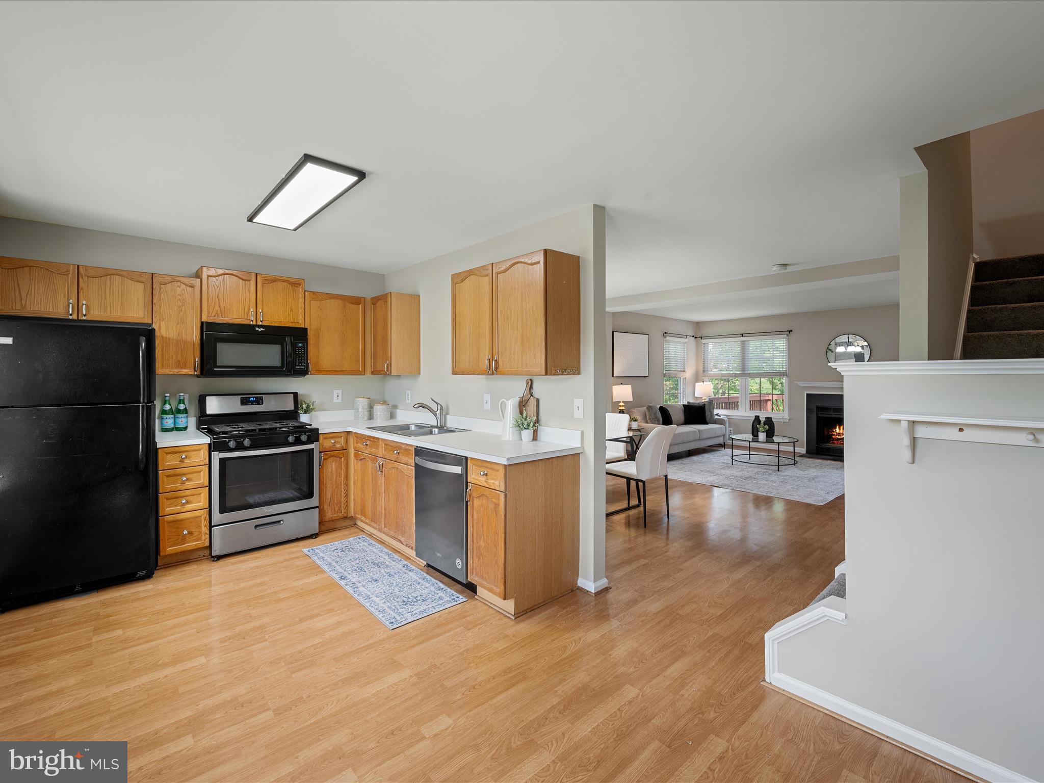20760 Apollo Terrace Ashburn, VA 20147 - Photo 18 of 50 a large kitchen with a large counter top stainless steel appliances and cabinets