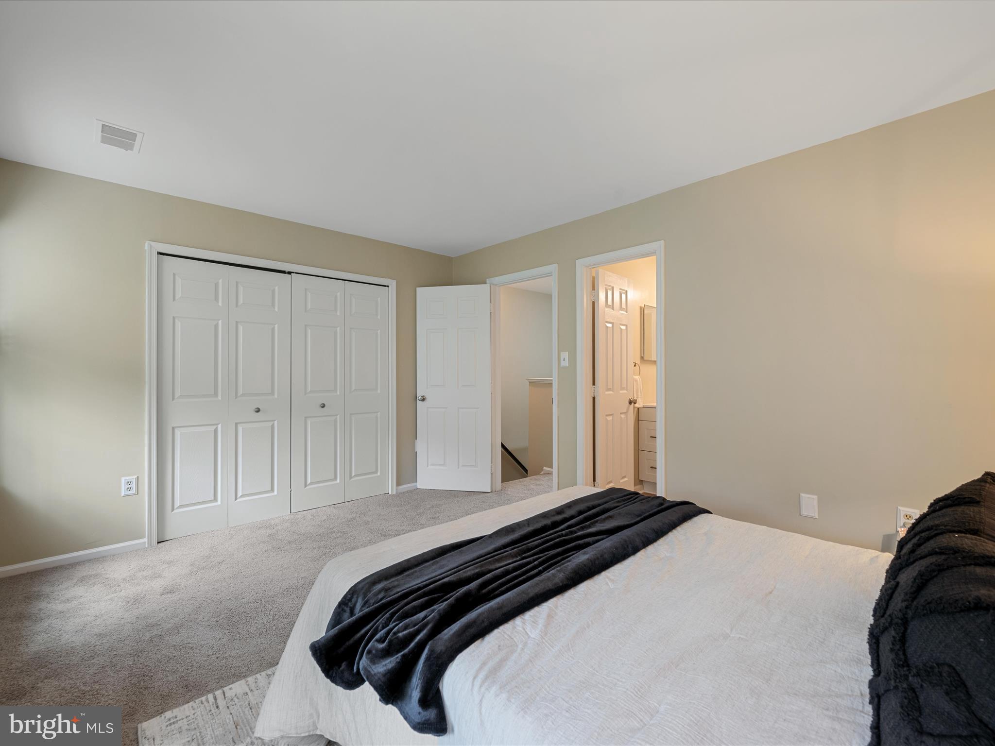 20760 Apollo Terrace Ashburn, VA 20147 - Photo 23 of 50 a bedroom with a bed and a closet