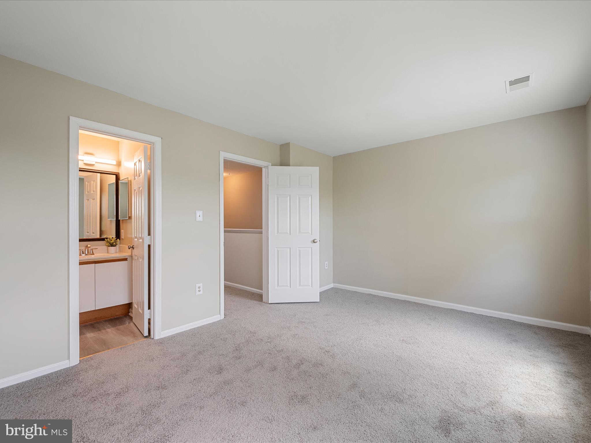 20760 Apollo Terrace Ashburn, VA 20147 - Photo 26 of 50 an empty room with closet and a bathroom