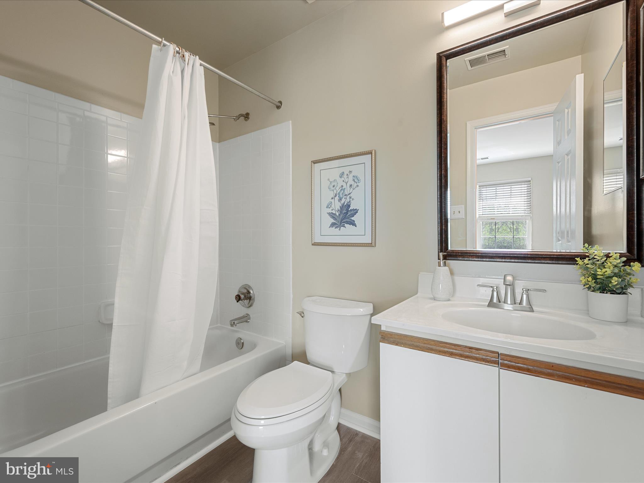 20760 Apollo Terrace Ashburn, VA 20147 - Photo 27 of 50 a bathroom with a sink toilet and shower
