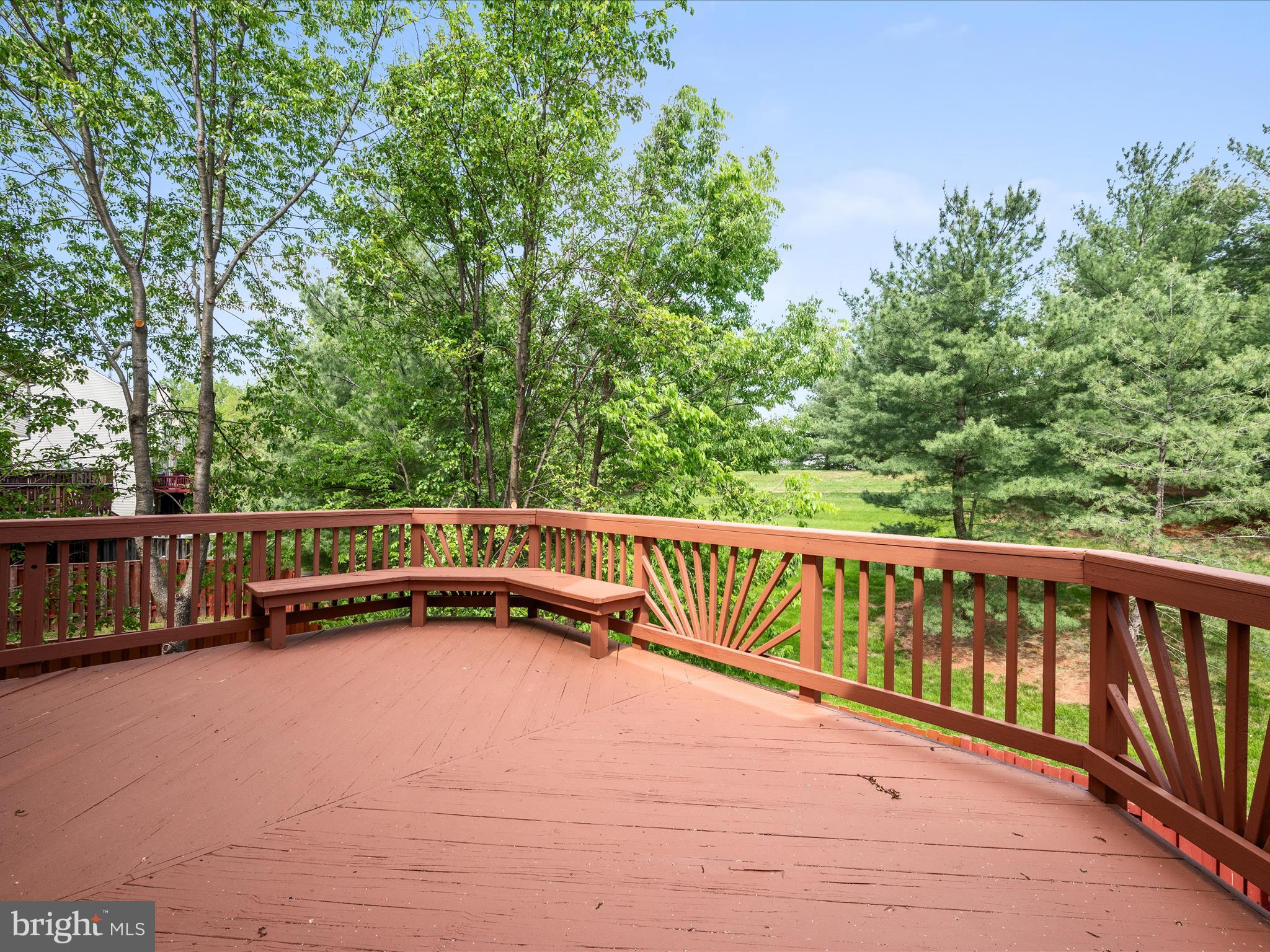 20760 Apollo Terrace Ashburn, VA 20147 - Photo 28 of 50 a view of balcony with two trees and wooden fence
