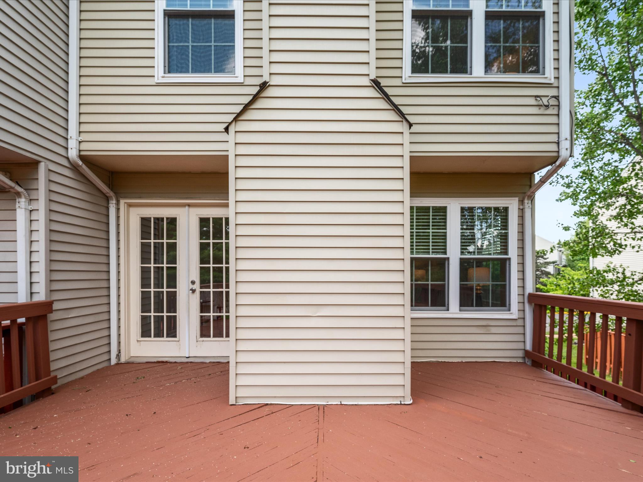 20760 Apollo Terrace Ashburn, VA 20147 - Photo 29 of 50 a view of a white house with large windows