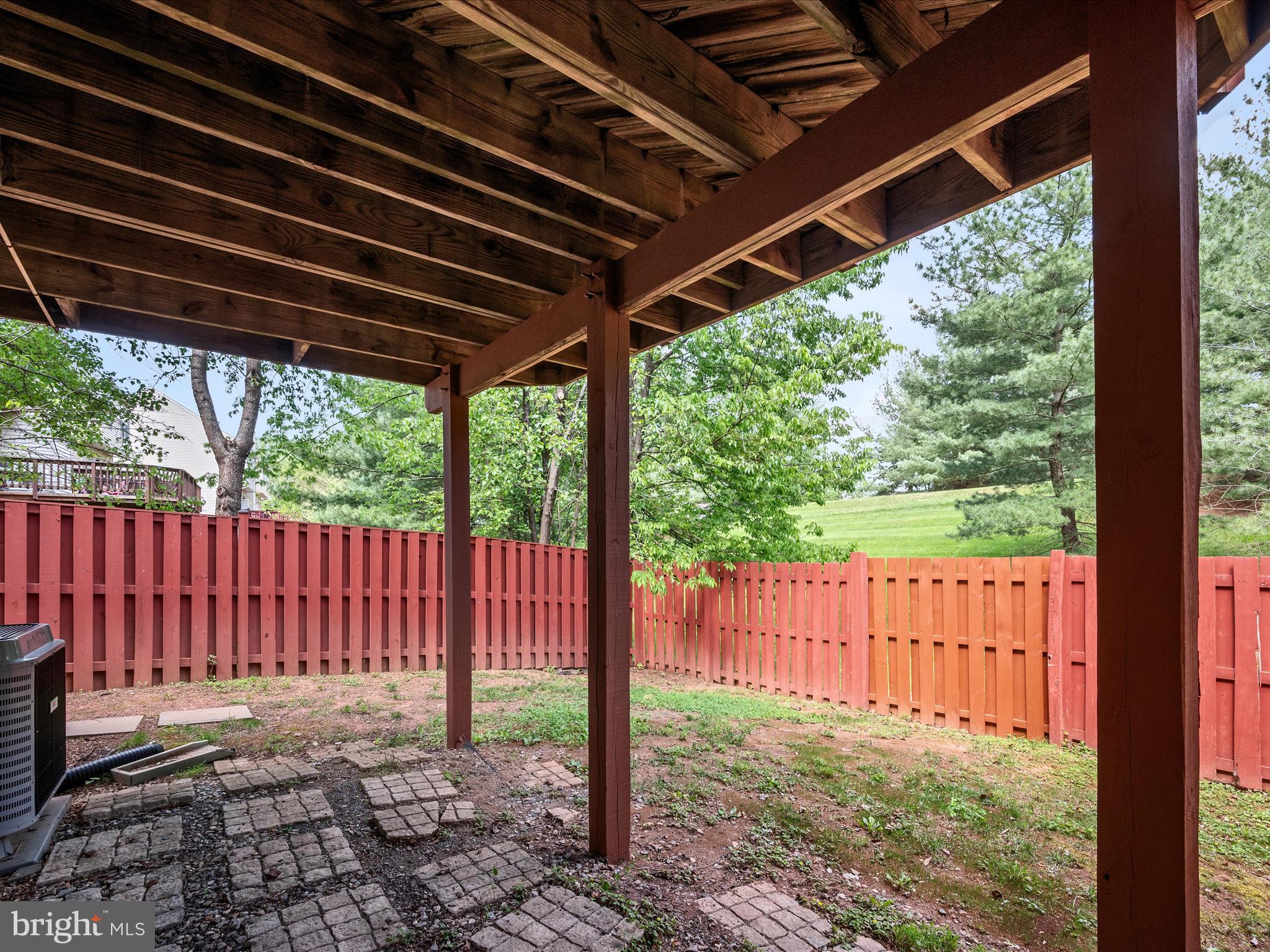 20760 Apollo Terrace Ashburn, VA 20147 - Photo 30 of 50 a view of a backyard with floor to ceiling window and wooden fence