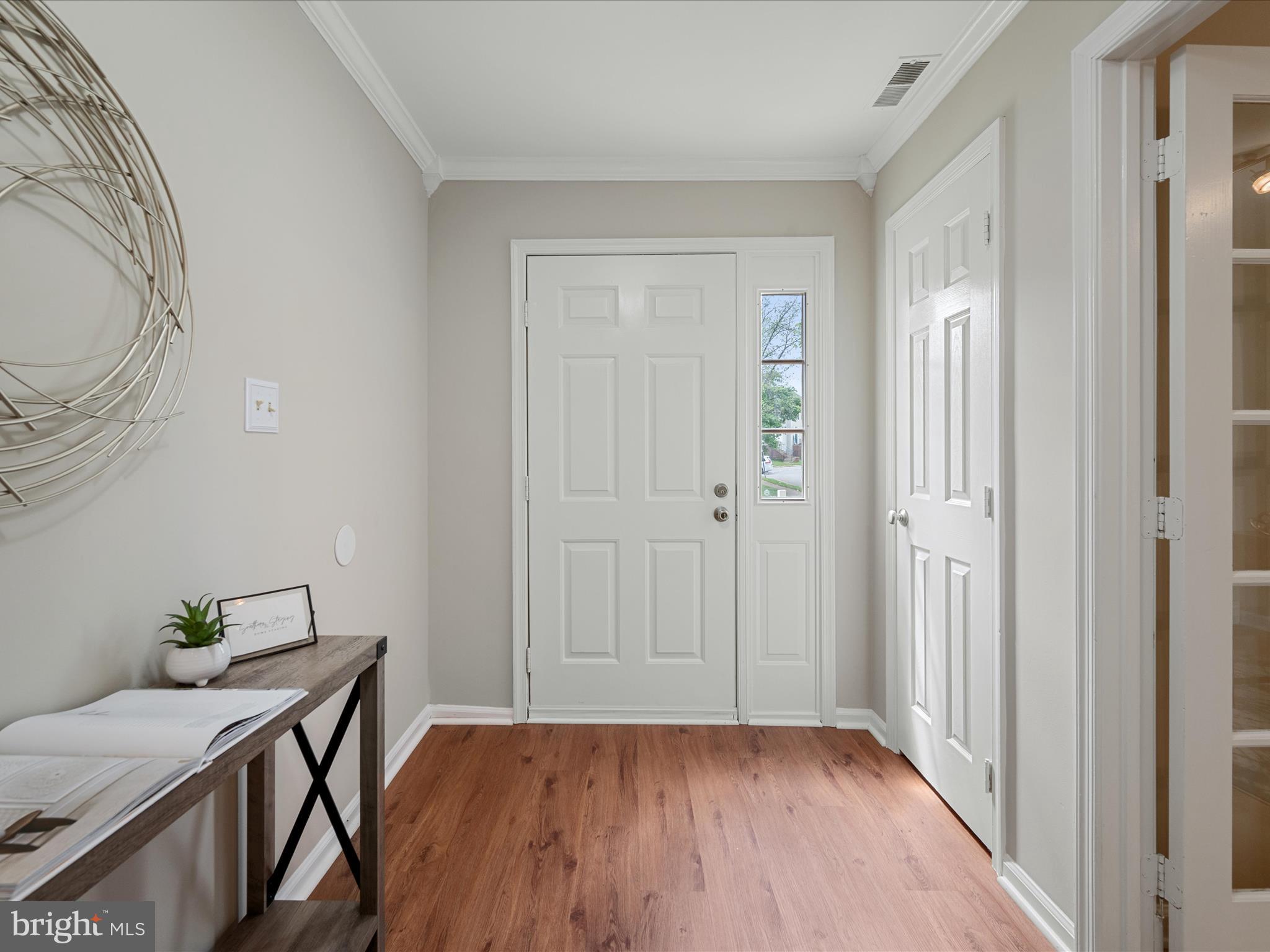 20760 Apollo Terrace Ashburn, VA 20147 - Photo 3 of 50 a view of a livingroom with wooden floor and dining room