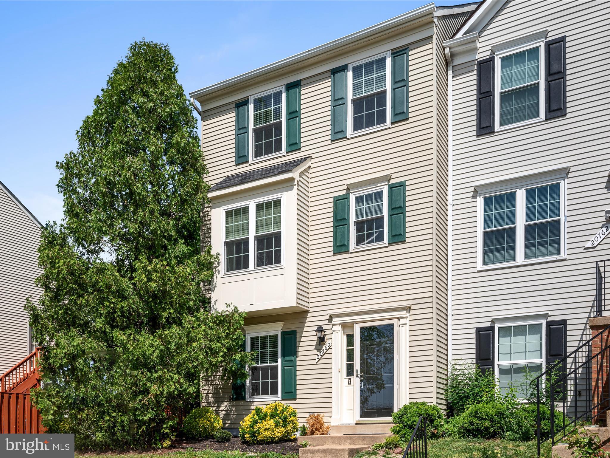 20760 Apollo Terrace Ashburn, VA 20147 - Photo 35 of 50 a front view of a house with a yard