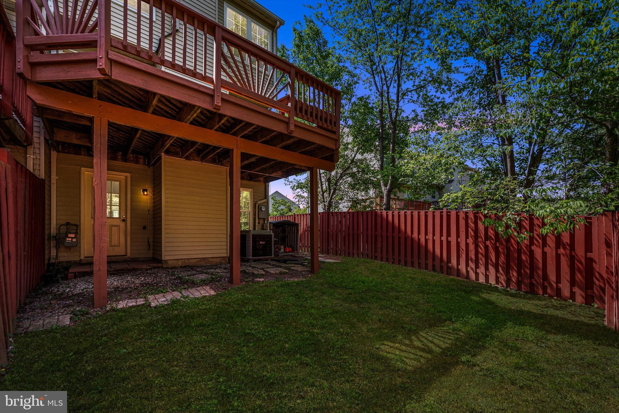 20760 Apollo Terrace Ashburn, VA 20147 - Photo 46 of 50 a view of a backyard with plants and large tree