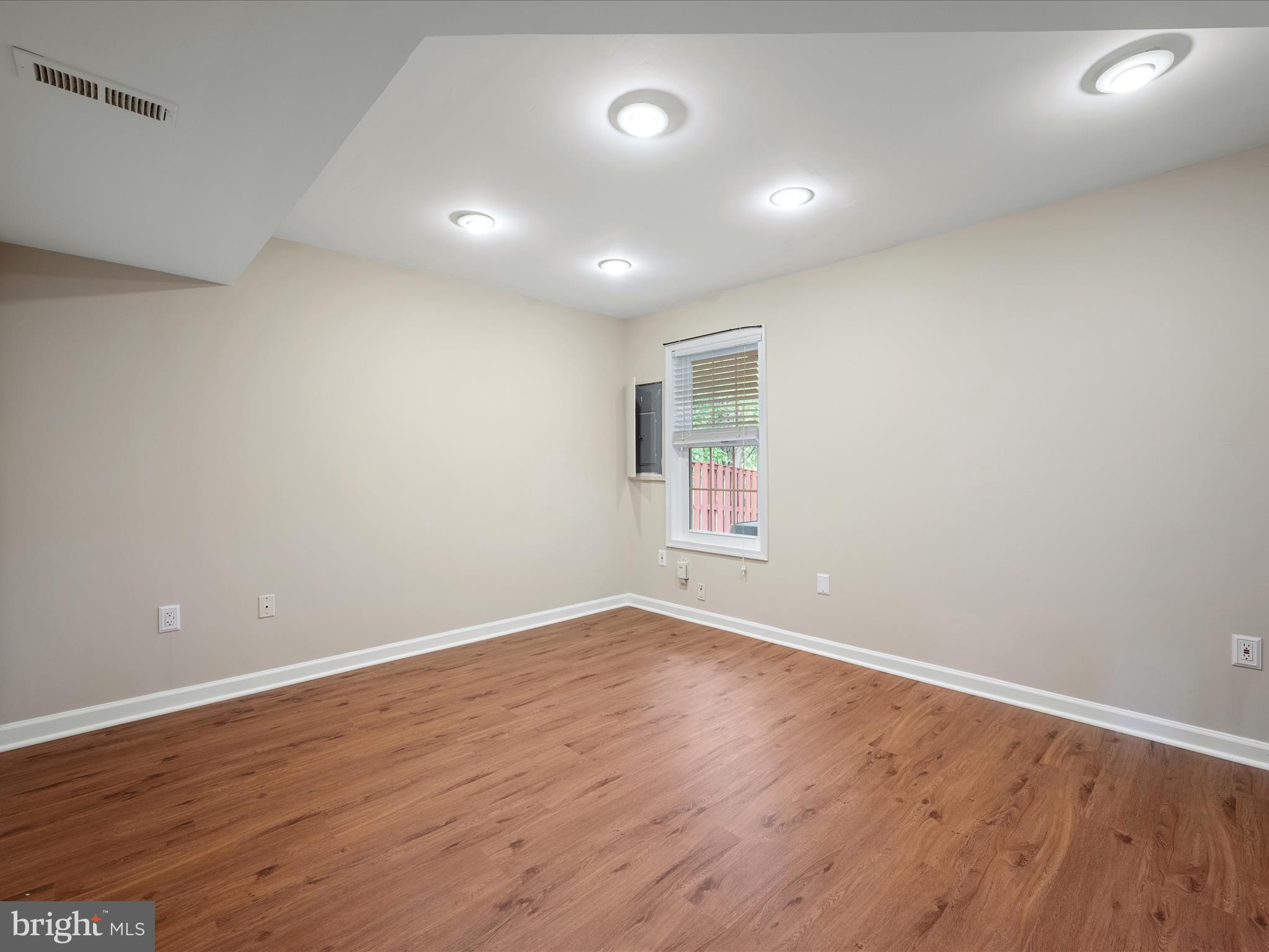 20760 Apollo Terrace Ashburn, VA 20147 - Photo 7 of 50 an empty room with wooden floor and windows