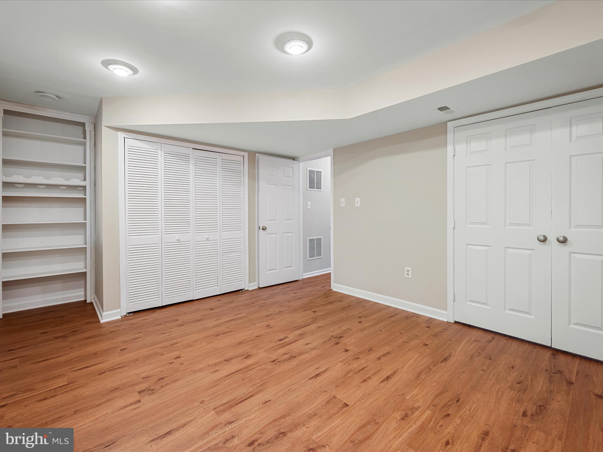 20760 Apollo Terrace Ashburn, VA 20147 - Photo 8 of 50 a view of an empty room with wooden floor and closet